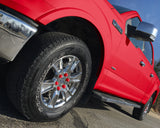 ColorLugs red colored lug covers on silver truck wheel