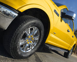 ColorLugs yellow colored lug covers on silver truck wheel