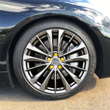 ColorLugs yellow colored lug covers on silver automobile wheel